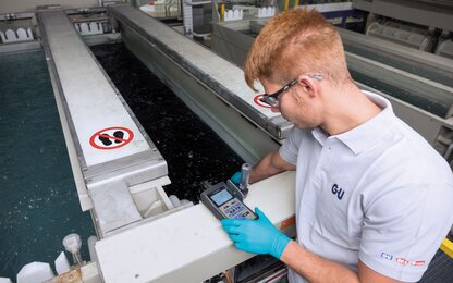 gu-about-us-employee-working-warehouse-landscape