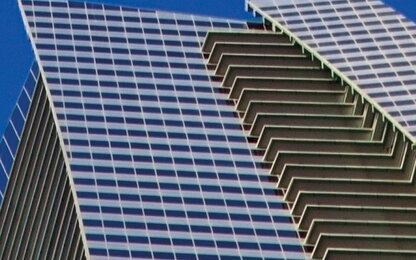 Facade with glass and staggered balconies