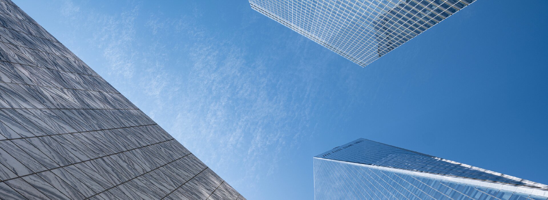 Skyscraper with glass facade and blue sky